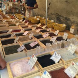 Spice vendor at open air market in Dieulefit, France.