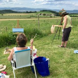 Marilyn and Nancy painting field behind B & B