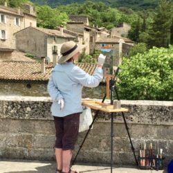 Nancy painting on bridge in Rochebaudin